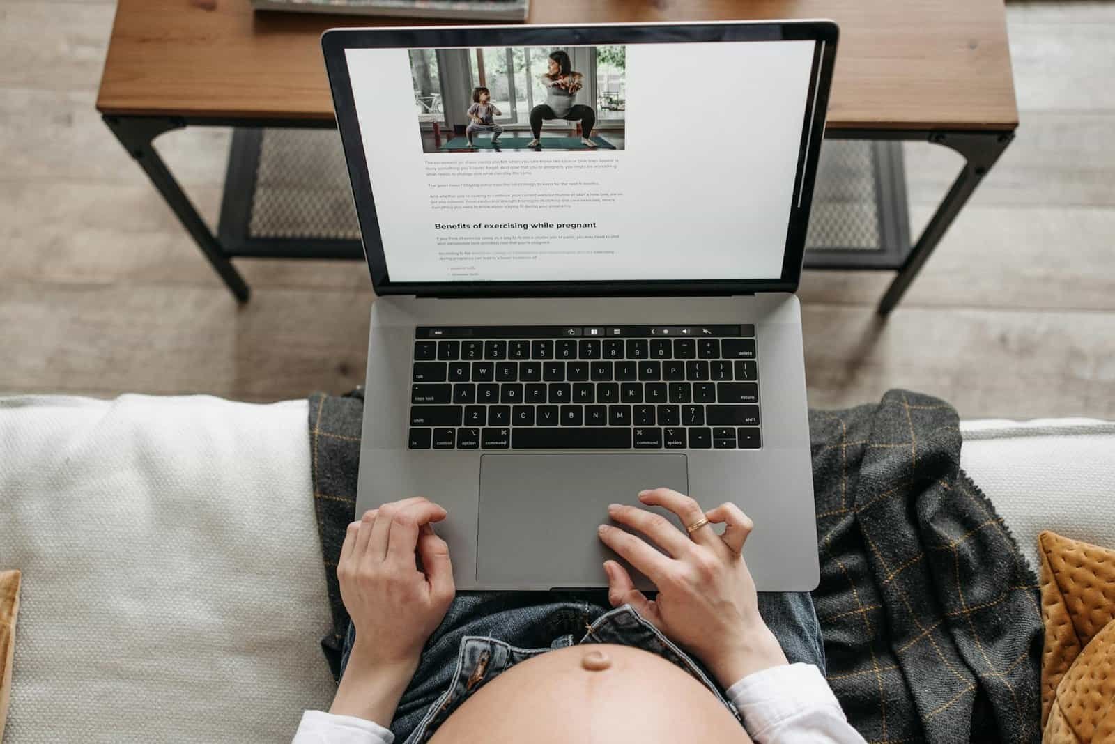 pregnant woman in Orlando reading an article about exercising while pregnant